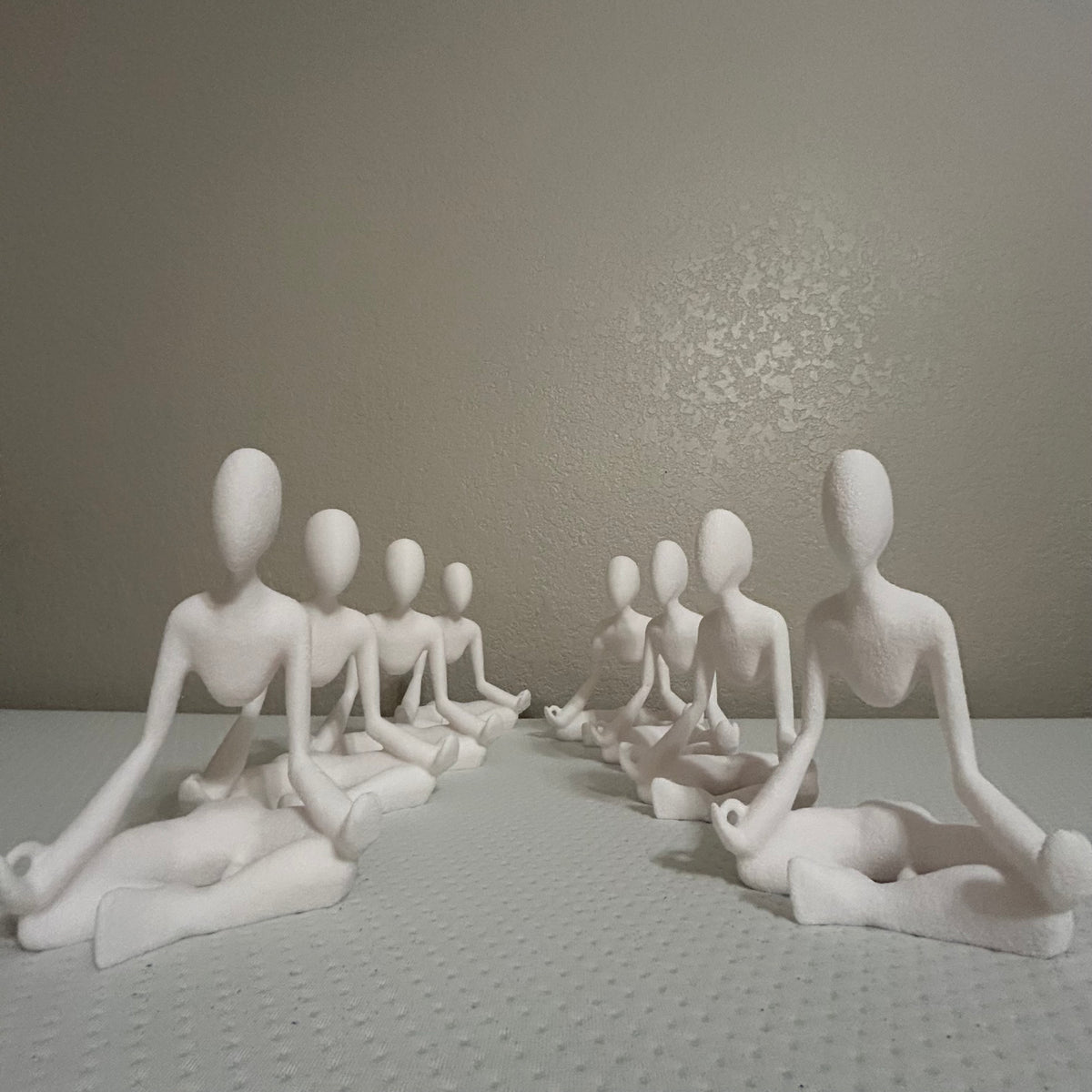 Medito sculpture shown on a desk.