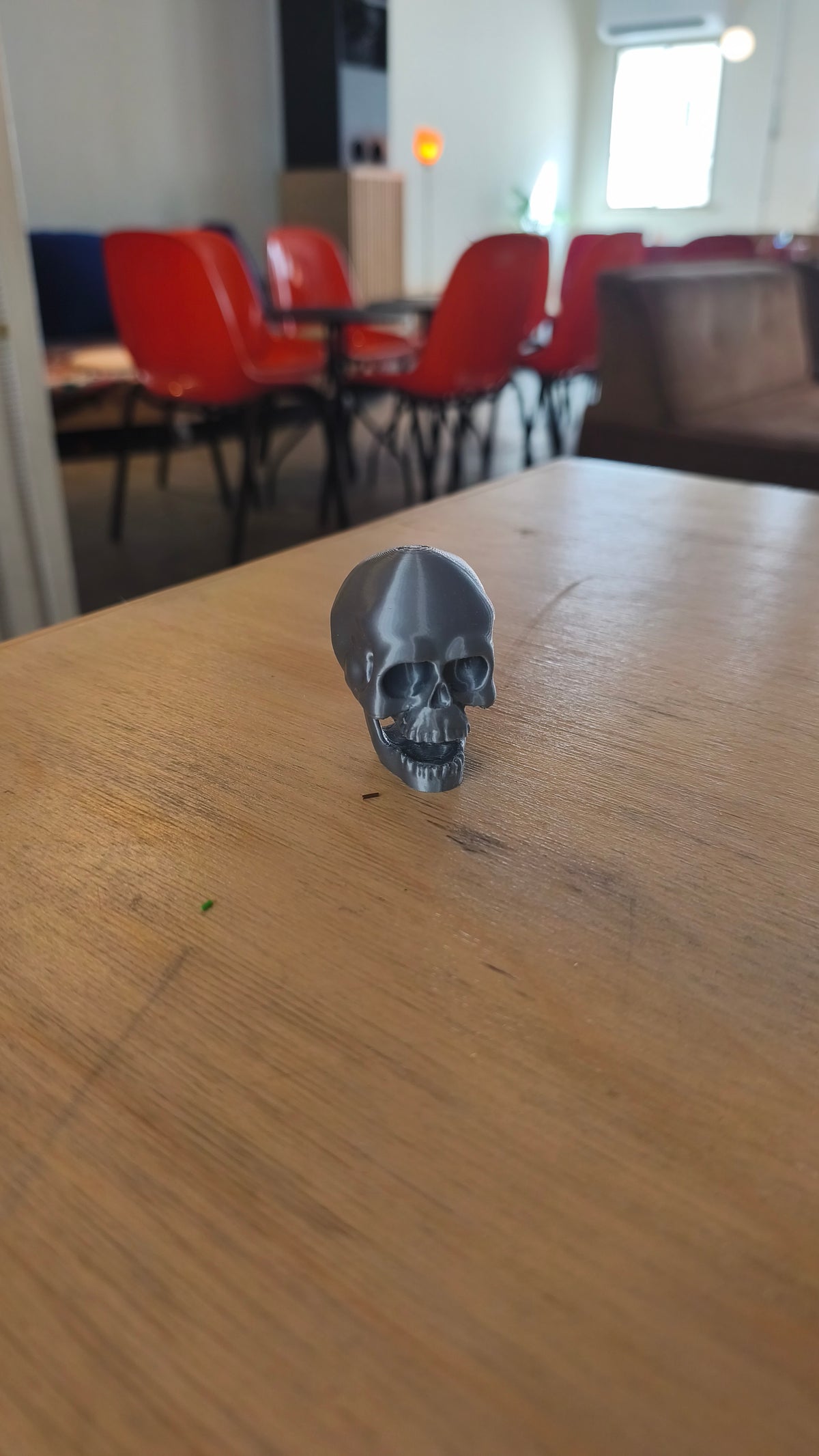 Skull clicker shown from the side.