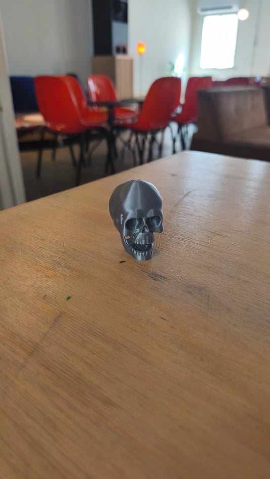 Skull clicker shown from the side.