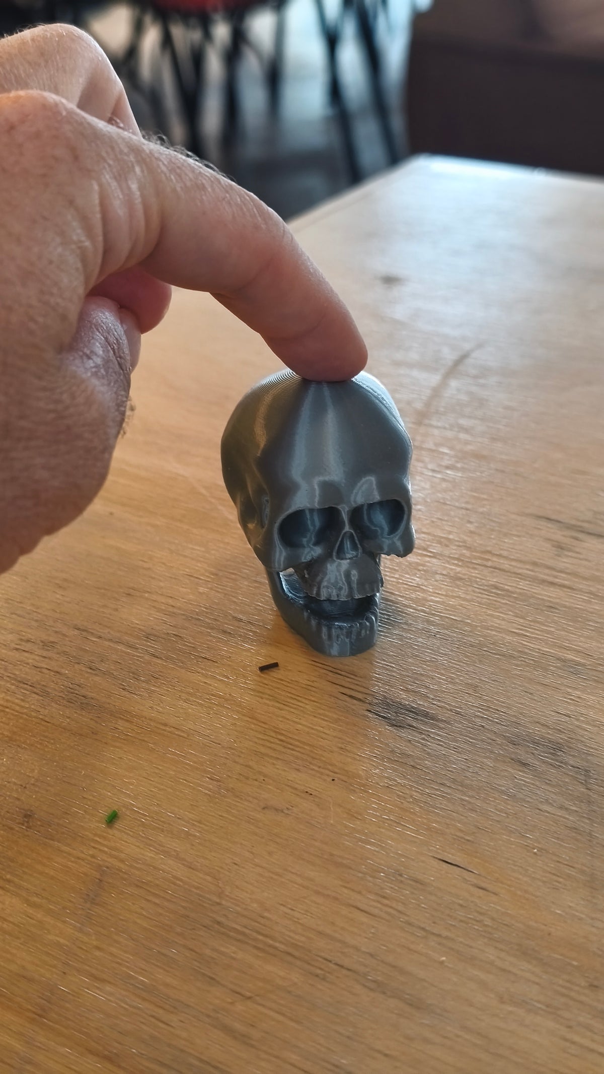 Skull clicker shown in multiple colours.