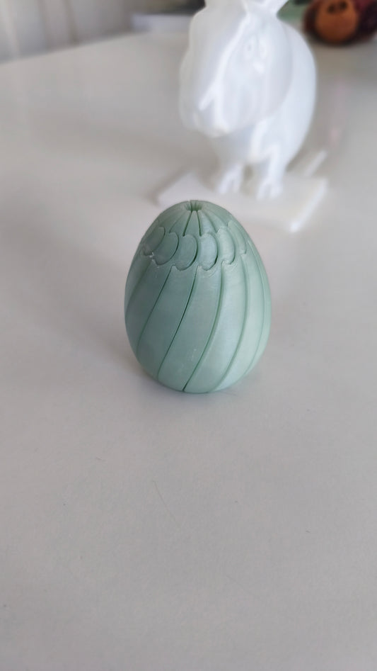 Easter egg slime fidget, 3D printed print-in-place squish toy. Design by Click Bait.