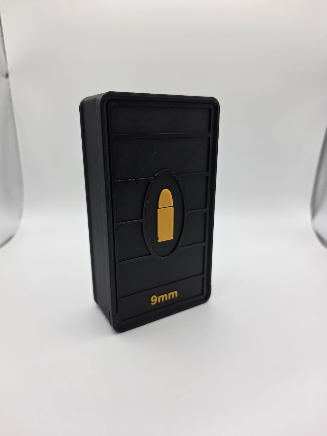 Side view of Black sliding-lid cartridge storage box