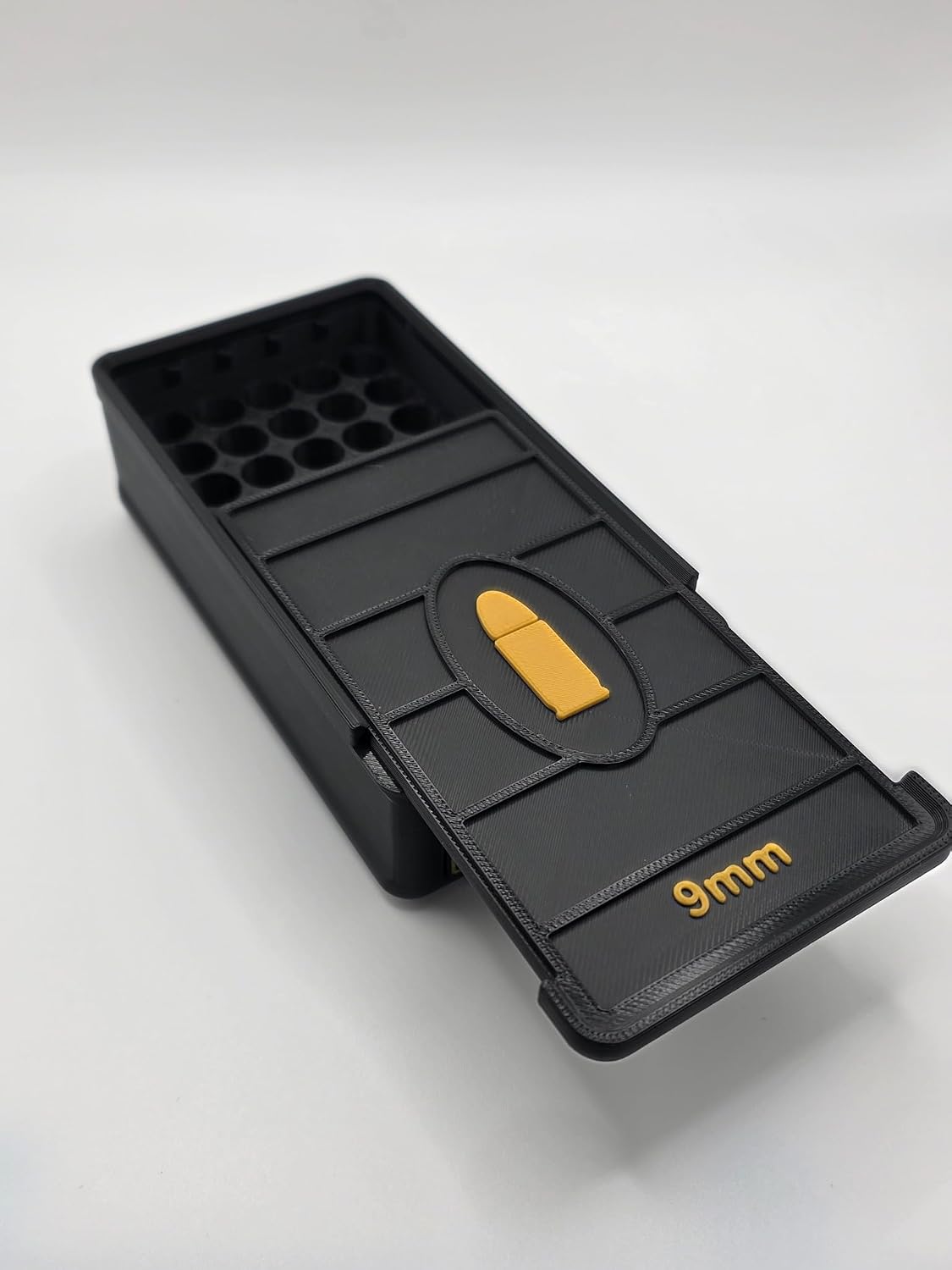 Open Black 3D printed 9mm cartridge storage box with empty 50-slot interior