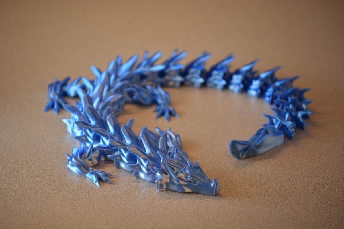 Articulated dragon shown coiled to show the flexible body.