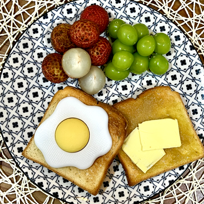 Fried egg clicker shown from above.
