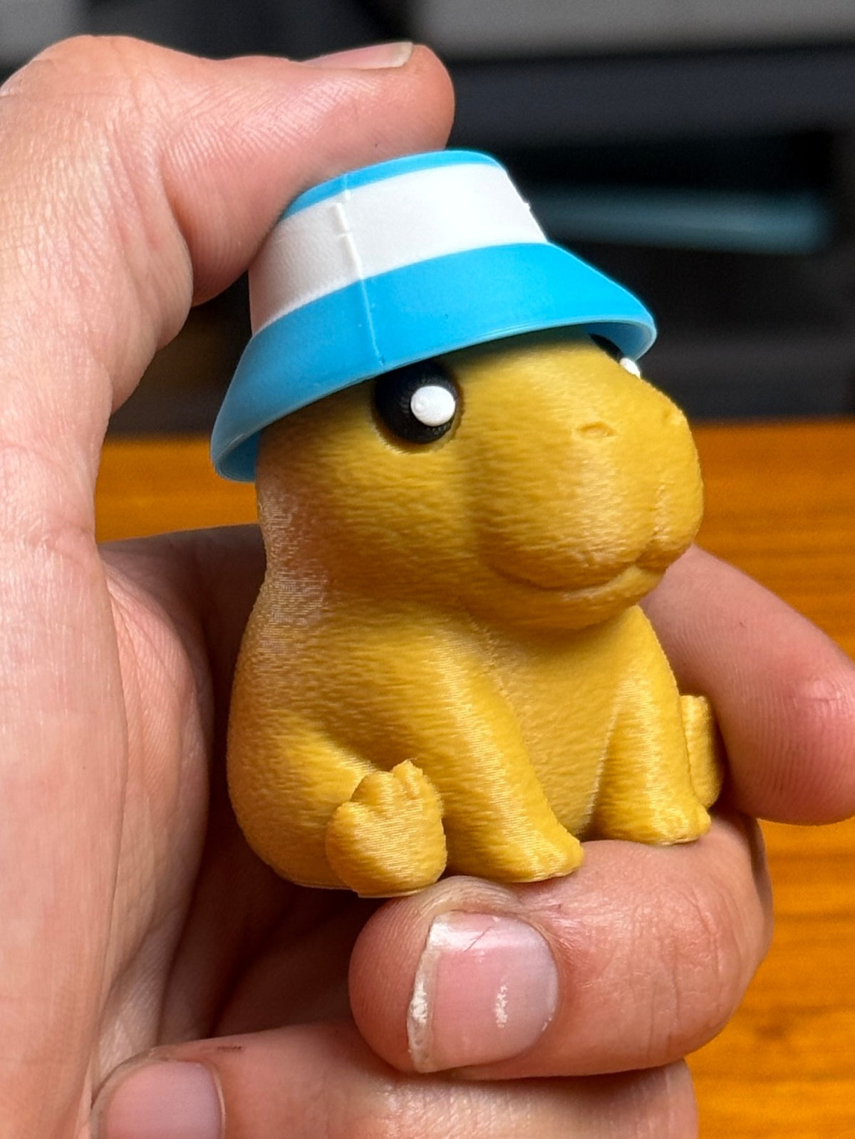 Capybara clicker shown in several colours.