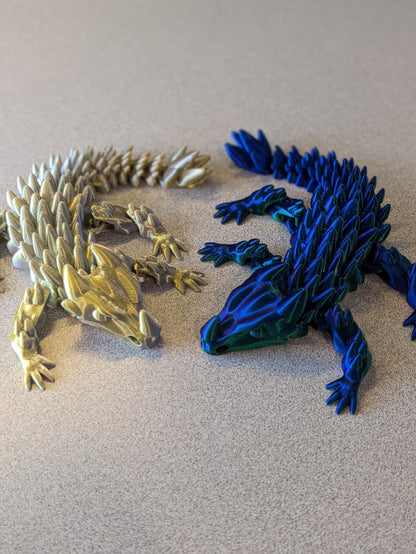 Baby dragon figure shown posed to show the articulation.