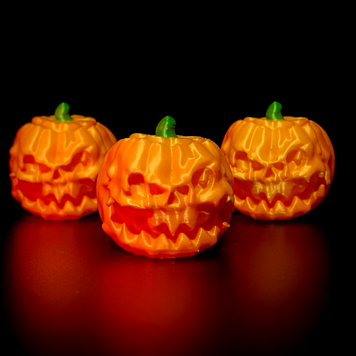 Carved pumpkin clicker shown from another angle.
