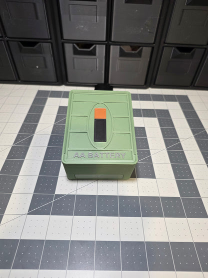 Closed green 3D printed AA battery storage case with sliding lid by SquigglePrintz