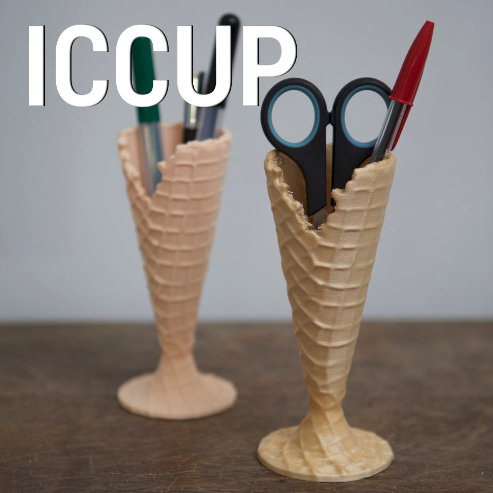 Iccup pencil holder in use on a desk.