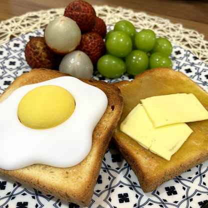 Fried egg clicker shown at an angle.