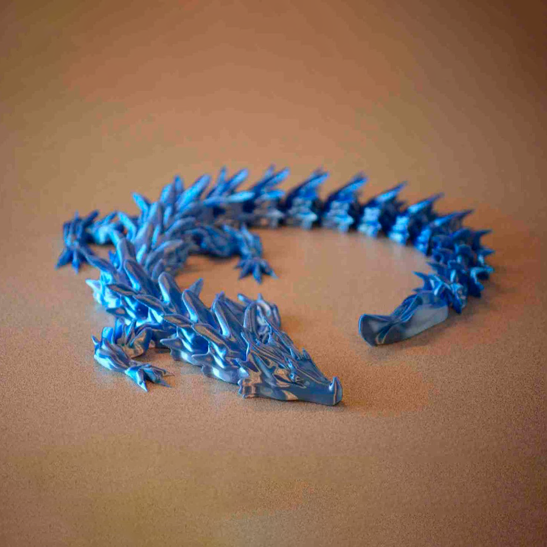 Water dragon articulated print-in-place figure, 3D printed. Design by Bearded Printer.