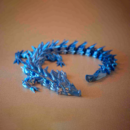 Water dragon articulated print-in-place figure, 3D printed. Design by Bearded Printer.