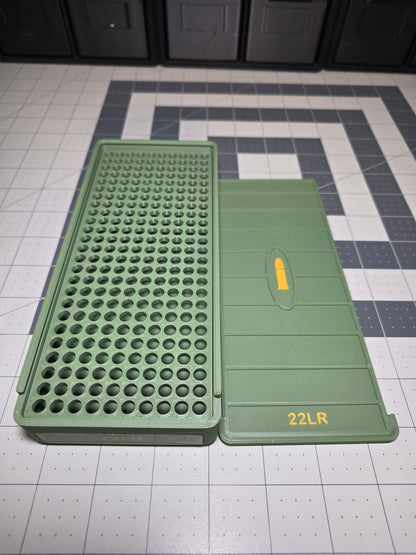Open .22LR ammo storage box showing 250-round cartridge hole grid base beside the removable sliding lid, 3D printed by SquigglePrintz